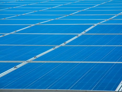 Photovoltaic system with blue sky and scattered clouds
