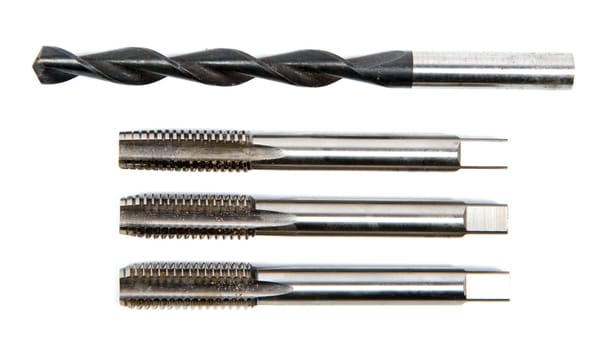 drill and screw taps on the white background