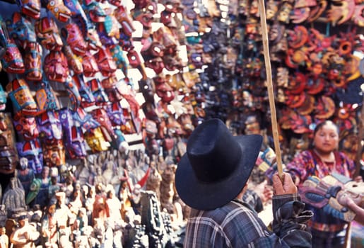 People in traditional clotes at the Market in the Village of Chichi or Chichicastenango in Guatemala in Central America.