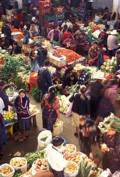 People in traditional clotes at the Market in the Village of Chichi or Chichicastenango in Guatemala in Central America.