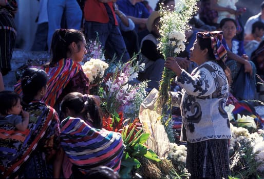 People in traditional clotes at the Market in the Village of Chichi or Chichicastenango in Guatemala in Central America.