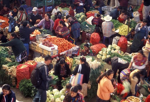People in traditional clotes at the Market in the Village of Chichi or Chichicastenango in Guatemala in Central America.