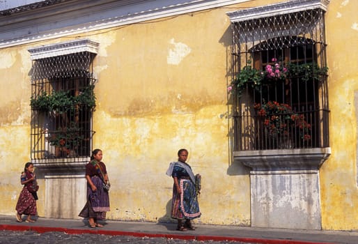 indio women in the old town in the city of Antigua in Guatemala in central America.
