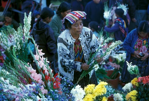 People in traditional clotes at the Market in the Village of Chichi or Chichicastenango in Guatemala in Central America.
