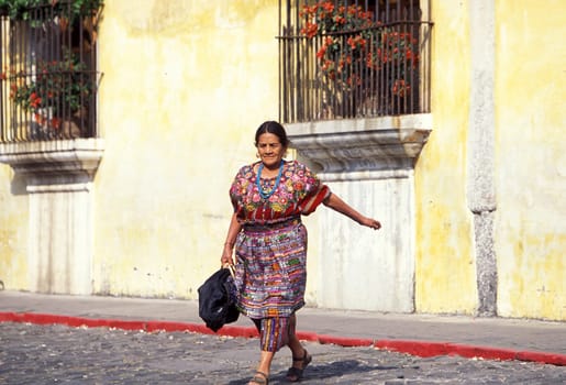 an indio women in the old town in the city of Antigua in Guatemala in central America.