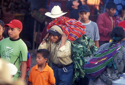 People in traditional clotes at the Market in the Village of Chichi or Chichicastenango in Guatemala in Central America.