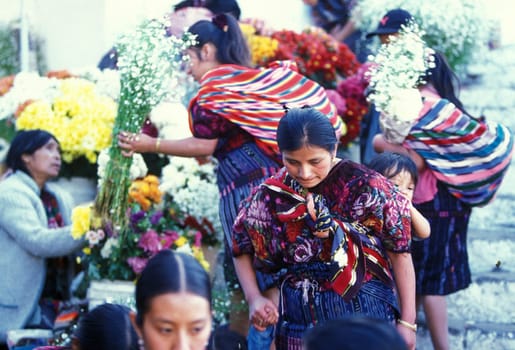 People in traditional clotes at the Market in the Village of Chichi or Chichicastenango in Guatemala in Central America.