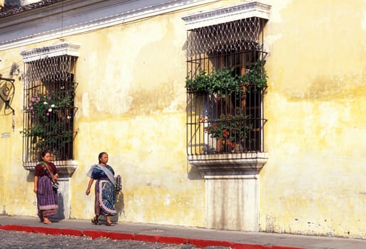 indio women in the old town in the city of Antigua in Guatemala in central America.