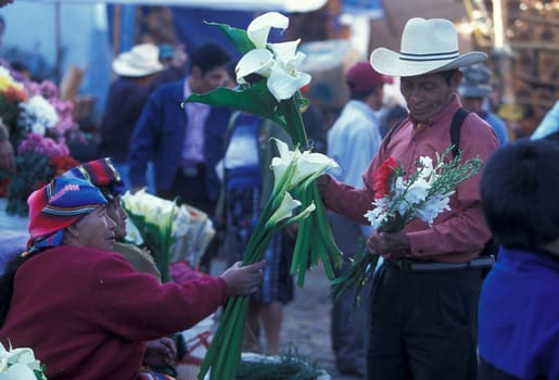 People in traditional clotes at the Market in the Village of Chichi or Chichicastenango in Guatemala in Central America.