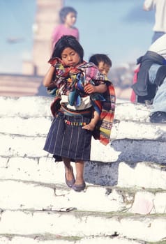 People in traditional clotes at the Market in the Village of Chichi or Chichicastenango in Guatemala in Central America.