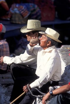 People in traditional clotes at the Market in the Village of Chichi or Chichicastenango in Guatemala in Central America.