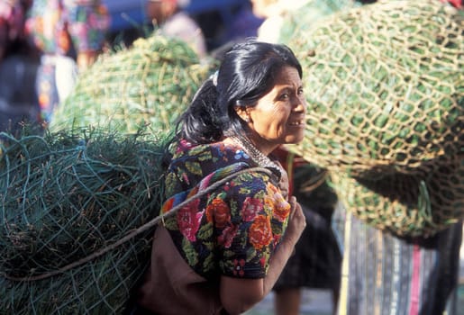People in traditional clotes at the Market in the Village of Chichi or Chichicastenango in Guatemala in Central America.