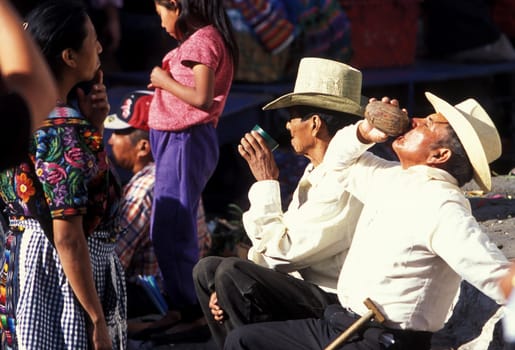 People in traditional clotes at the Market in the Village of Chichi or Chichicastenango in Guatemala in Central America.