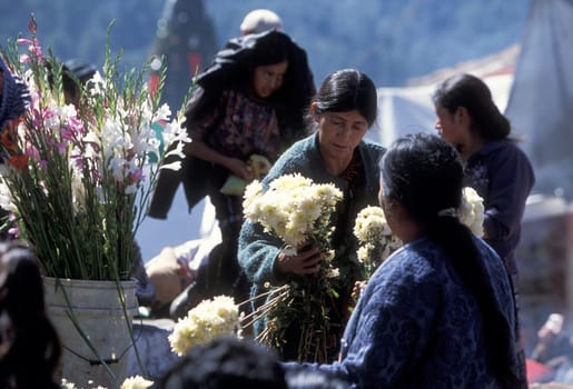 People in traditional clotes at the Market in the Village of Chichi or Chichicastenango in Guatemala in Central America.