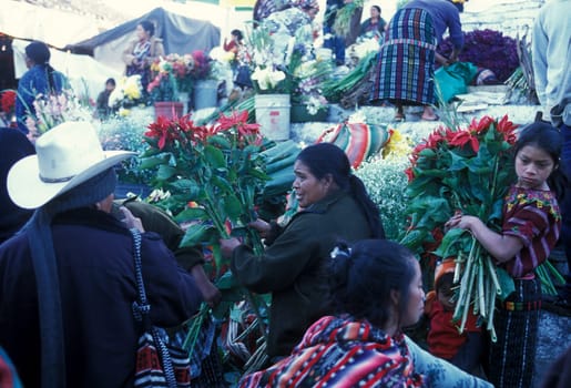 People in traditional clotes at the Market in the Village of Chichi or Chichicastenango in Guatemala in Central America.