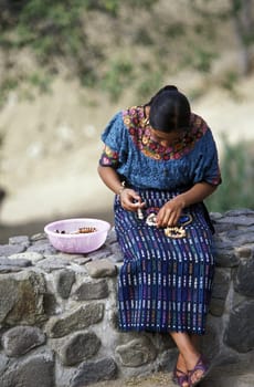 people in traditional clotes in the Village of  Panachel in Guatemala in central America.