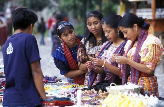 Women at a Market in the old city in the town of Antigua in Guatemala in central America.