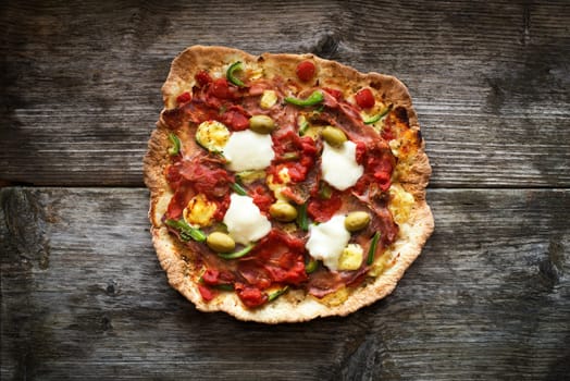 Delicious italian pizza served on wooden table