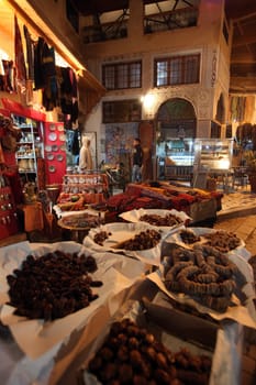 a smal Marketroad in the Medina of old City in the historical town of Fes in Morocco in north Africa.
