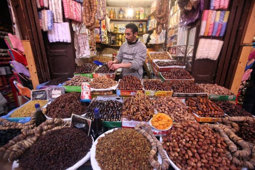 a shop in the Marketroad in the Medina of old City in the historical town of Fes in Morocco in north Africa.