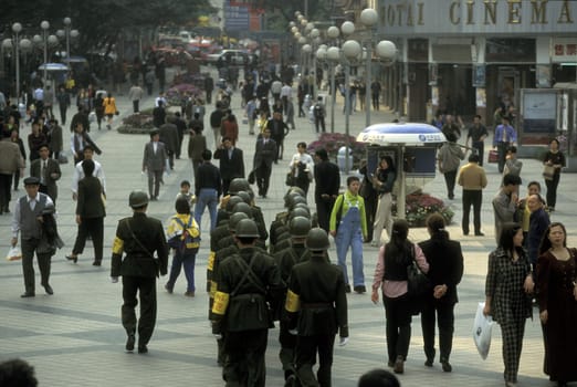 The army and people on the streets of Chongqing in the province of Sichuan in china in east asia.