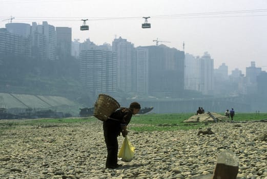 the cable car on the way over the yangzee River in the city of Chongqing in the province of Sichuan in china in east asia.