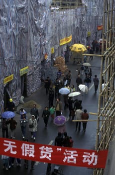 a street in the city of Canton or Guangzhou in the north of Hongkong in the province of Guangdong in china in east asia.