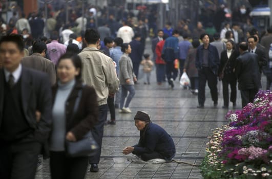 People at the main square in the city of Chongqing in the province of Sichuan in china in east asia.