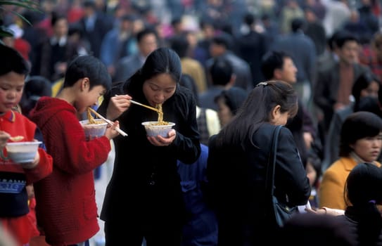 People at the main square in the city of Chongqing in the province of Sichuan in china in east asia.
