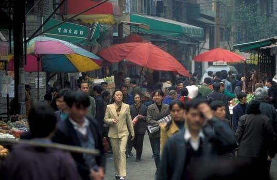 Transport people at the main square in the city of Chongqing in the province of Sichuan in china in east asia.