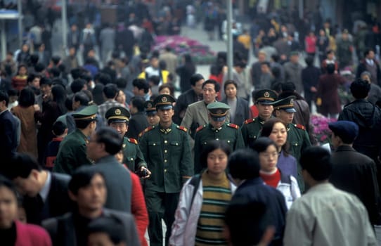 The army and people on the streets of Chongqing in the province of Sichuan in china in east asia.
