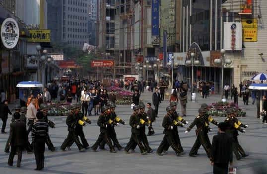 The army and people on the streets of Chongqing in the province of Sichuan in china in east asia.