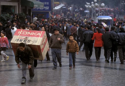 Transport people at the main square in the city of Chongqing in the province of Sichuan in china in east asia.