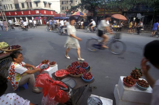 a streetmarket in the City of Shanghai in china in east asia.