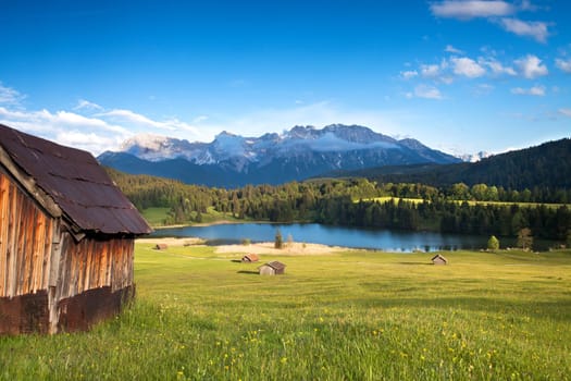Wooden hut on Lake Gerold see with Karwendel