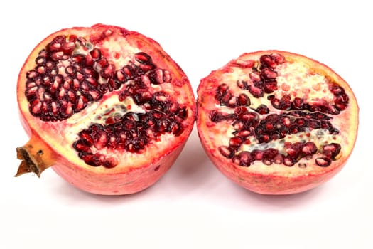Pomegranate,sliced tropical fruit on a white background
