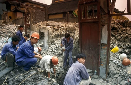 working people in the construction in the City of Shanghai in china in east asia.