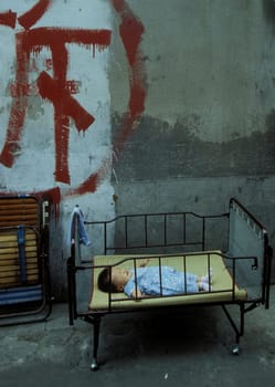 a baby sleeps in the City of Shanghai in china in east asia.