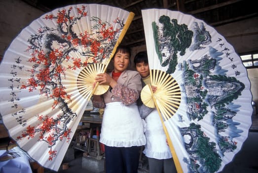 a women in a shop in the town of Yangshou near the city of Guilin in the Province of Guangxi in china in east asia.