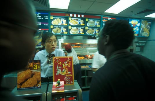 KFC shop in a market street in the city of Shenzhen north of Hongkong in the province of Guangdong in china in east asia.