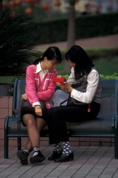 women in a parc in the city of Shenzhen north of Hongkong in the province of Guangdong in china in east asia.