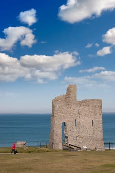 a beautiful path with tourist walking to Ballybunion beach and castle