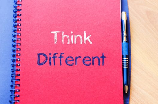 Think different text concept write on notebook