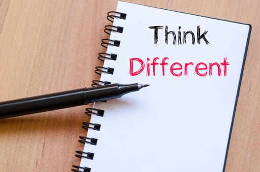 Think different text concept write on notebook