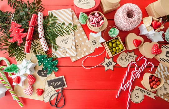 Advent calendar made of small boxes and wraps with sweets