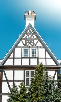 Old half-timbered  house in street of Gdansk, Poland, Europe. Beautiful sunny day, old building. German style in architecture.