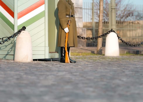 Soldier on guard at Buda Castle Hill near presidential palace. Old town of Budapest city, Hungary, Europe. Famous travel destination.
