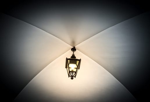 Beautiful old lantern hanging from ceiling in Krakow, Poland, Europe. Old Town UNESCO World Heritage Site.
