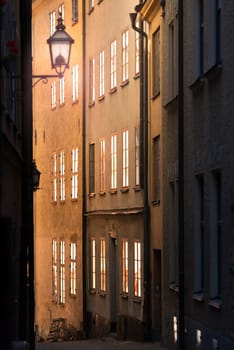 Sunrise or sunset in street of Gamla stan. Stockholm, Sweden, Scandinavia, Europe.