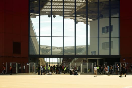 Mainz,Germany – August 06,2016: Fans stand in front of the entrance of the Opelarena and go to the friendly match between Liverpool FC and 1st FSV Mainz 05 in Mainz on August 6,2016.